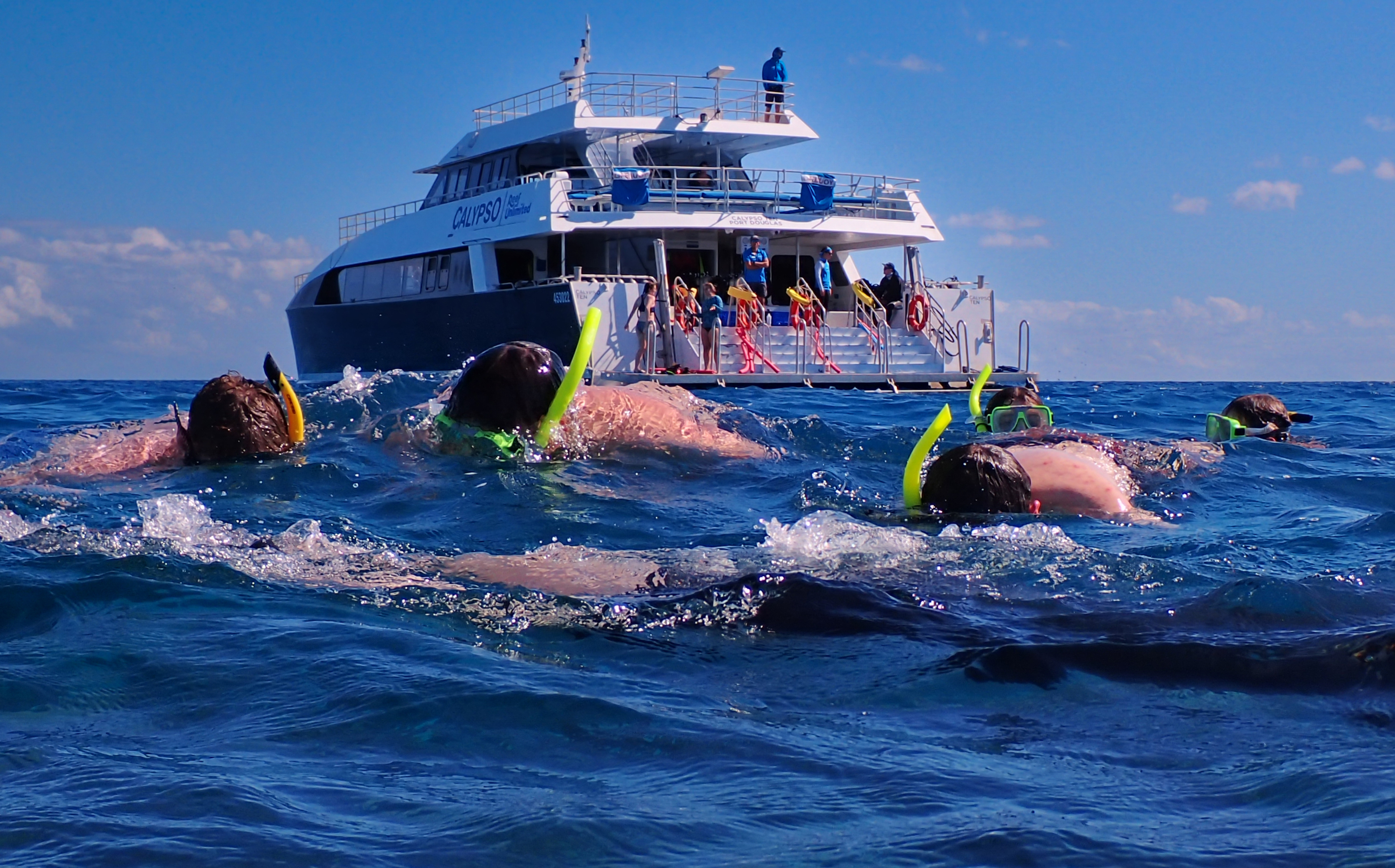 Students snorkel on the Great Barrier Reef.