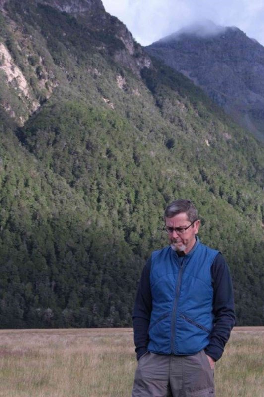 Dr. Robert Bush contemplates a glacial valley in Fiordland National Park, New Zealand