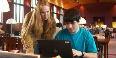 Students looking at a laptop screen