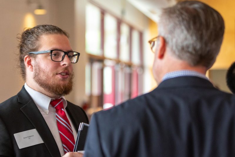 Student talking to employer